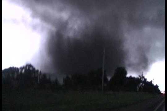 Storm Chasers Being Chased by Huge Tornado