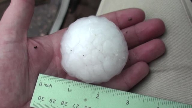 Two Inch Hailstone Hail in Hand