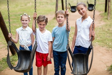 Kids standing together in park