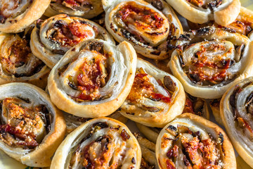 Background with french pastry rolls baked in oven, close-up