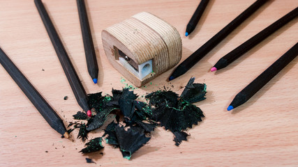 A pencils and wooden pencil sharpener.