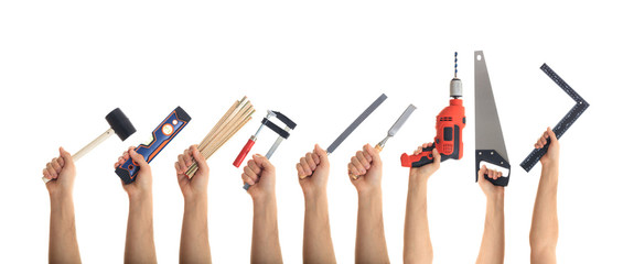 Hands holding tools on white background