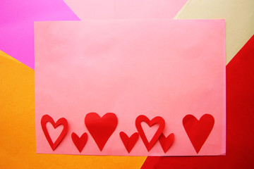 Red hearts on the variegated background