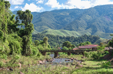 Naklejka premium Mountain river stream landscape at the rural village.