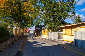 Sunny and green road throw yards of cosy Haapsalu, Estonia