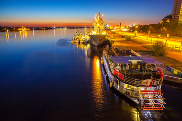 Big ship staying near old town of Riga