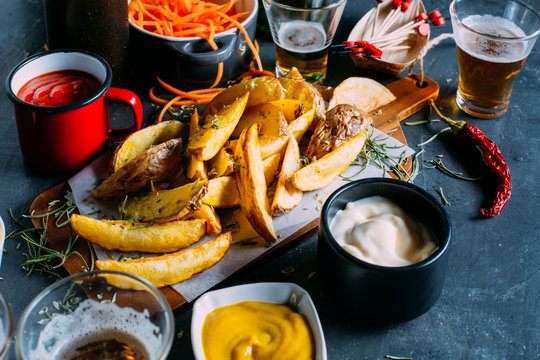 Fries with sauces and beers
