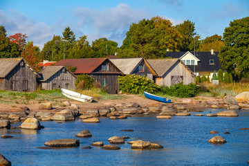 Fototapeta na wymiar Harbour with fishers' houses on the stoned coast of Baltic sea. Kasmu, village of captains, Estonia