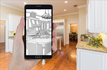 Hand Holding Smart Phone Displaying Drawing of Custom Kitchen Photo Behind.