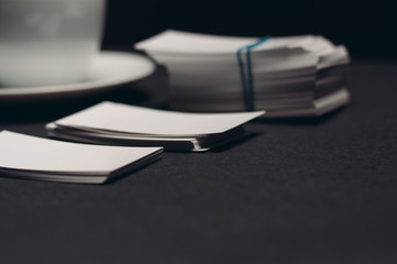 badges on the table, business cards, dark background