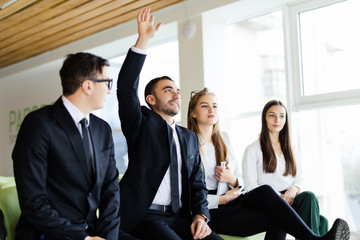 Corporate work. Manager have a question at topics of speaker.