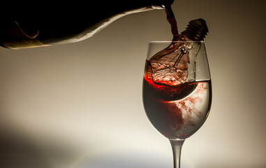 Fototapeta na wymiar Concept Picture Bottle of Wine with Glass and Bulb Color