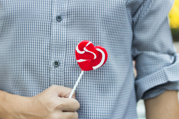 Man hold lollipop on hand,valantine concept