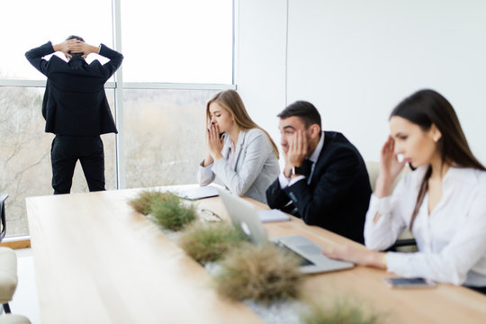 Unhappy And Sad Business People Of Lose  In Meeting Room