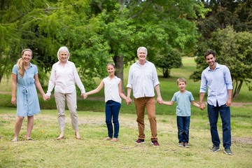 Multi-generation family enjoying together in park