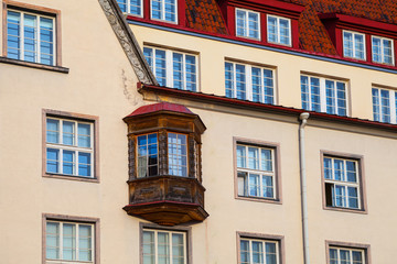 Medieval house with wooden balcony on City Hall Square of Old Tallinn, Estonia