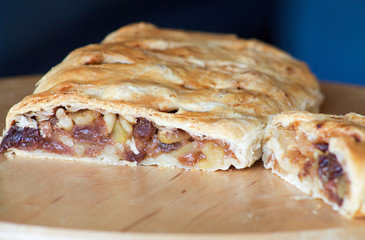 apple strudel cut on round cutting board