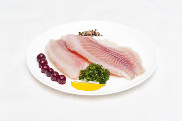 raw fish fillet white plate isolated