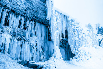 Fototapeta na wymiar Ice cave in frozen waterfall Jagala, Estonia