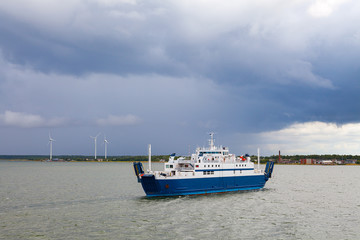 Small passenger ferry in Baltic sea, cloudy weather