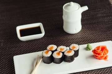 Traditional fresh Japanese sushi rolls on a white plate © maxfotoadobe