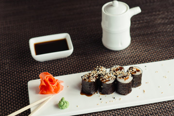 Traditional fresh Japanese sushi rolls on a white plate © maxfotoadobe