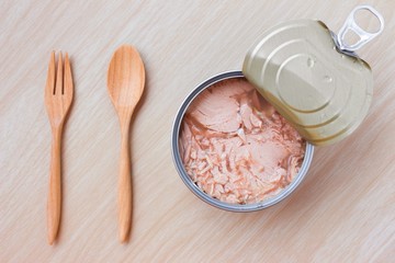 canned tuna isolated on wood background / Canned soy free albacore white meat tuna packed in water