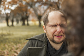 Man having make up by a stylist. Outdoors