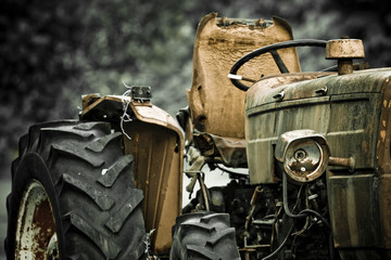 Rusty tractor abandoned in a field