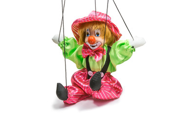 Sitting clown puppet isolated on white background
