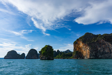 Island cliffs in turquois sea and blue sky