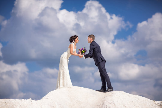 Wedding in Santorini, bride and groom kissing in honeymoon