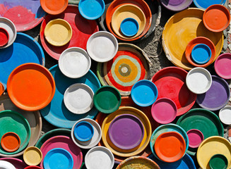 Background of colorful plates hanging on the wall