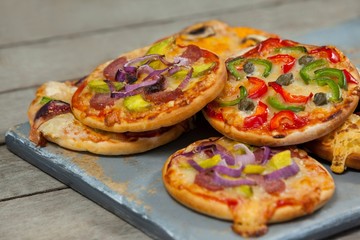 Various delicious italian pizza on pizza peel