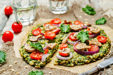 Kale oats pizza crust with tomato, red onion and mushrooms