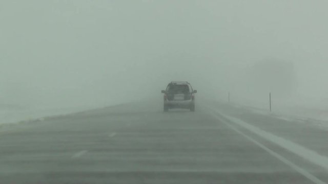 Driving In Winter Blowing Snow On Rural Highway