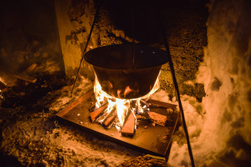 Cooking in a pot over campfire