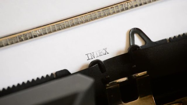 Typing the word Index with in a old manual typewriter
