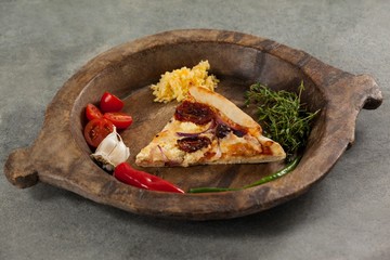 Spices and vegetable with slice of italian pizza