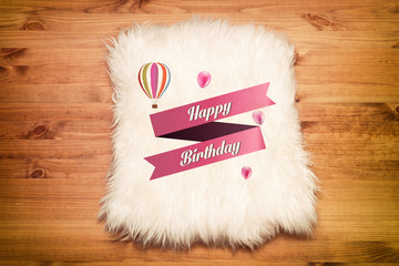 happy birthday. fur carpet on wood floor