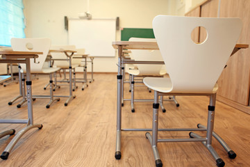 Empty classroom with chairs and desks