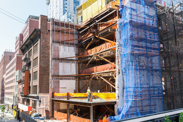 Naklejka premium Building of new house in city line.