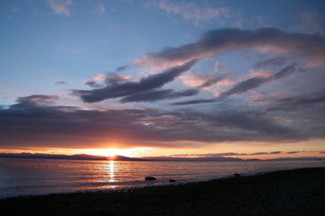 Fototapeta na wymiar Sunset on the Ocean with Clouds