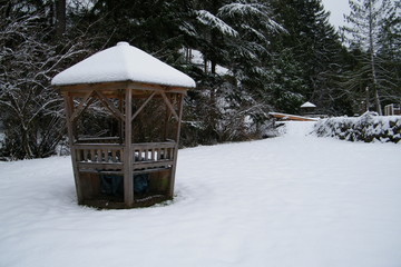 Wooden Gazebo in a Snowy Field