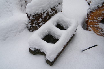 Cinder Block Brick with Firewood in the Snow