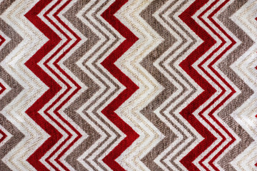 red colored fabric with zig zag pattern