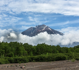 Volcanic cone Koryaksky in clouds - Kamchatka, Russia