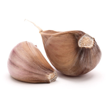 Two garlic cloves isolated on white background cutout