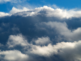 huge clouds on a blue sky background