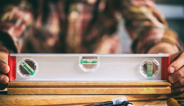 Carpenter working with a spirit level